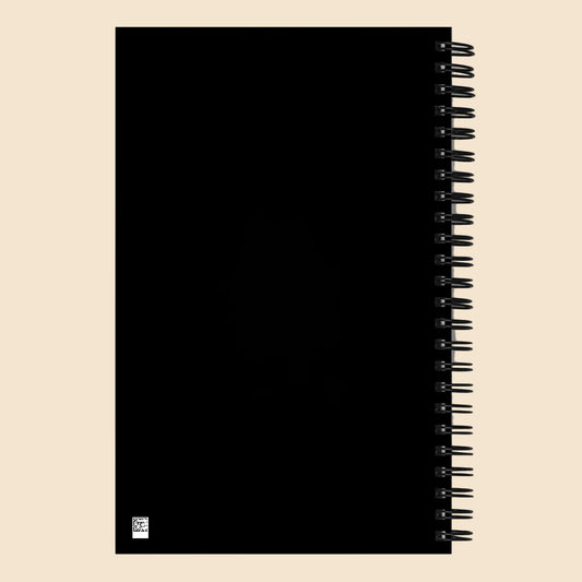 Parte trasera negra de libreta de espiral con encuadernación metálica.
