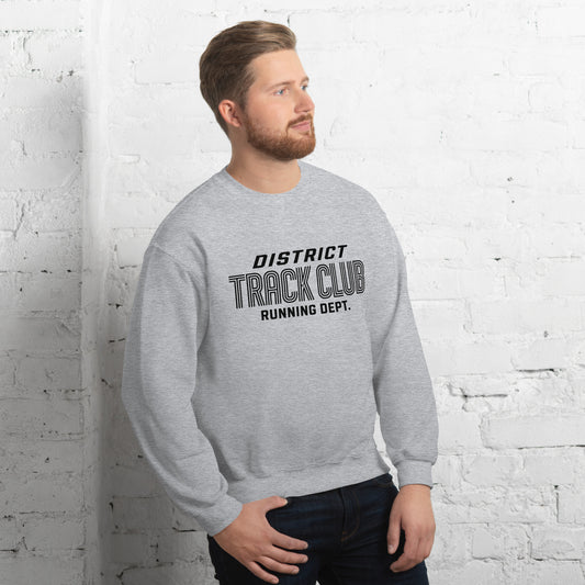 Hombre sonriendo con sudadera gris deportiva de cuello redondo y diseño Track Club.