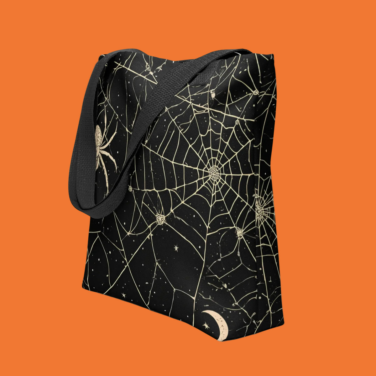 Bolsa de tela negra con estampado integral de telarañas, araña, luna creciente y estrellas en tono crema
