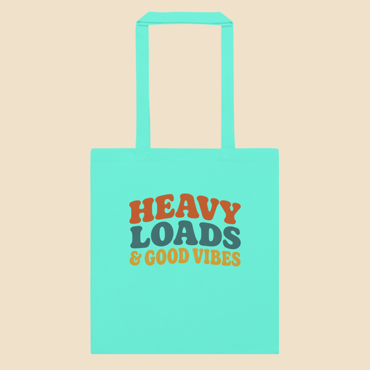 Bolsa de tela tote bag de algodón en color menta con diseño tipográfico retro Heavy Loads and Good Vibes.
