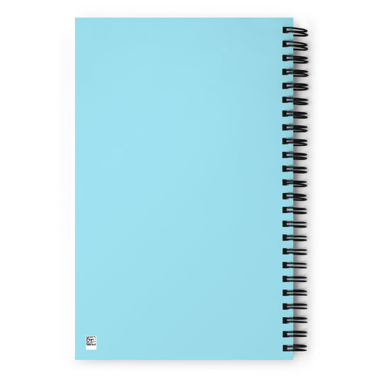 Parte trasera de libreta de espiral con diseño azul y encuadernación metálica.