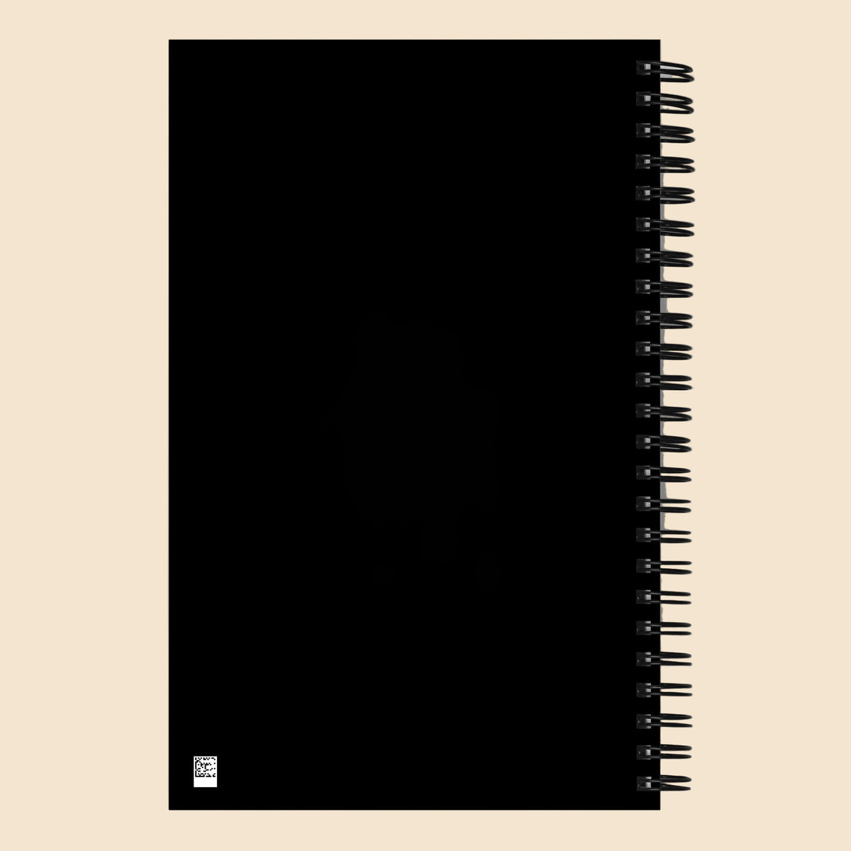 Parte trasera negra de libreta de espiral con encuadernación metálica.