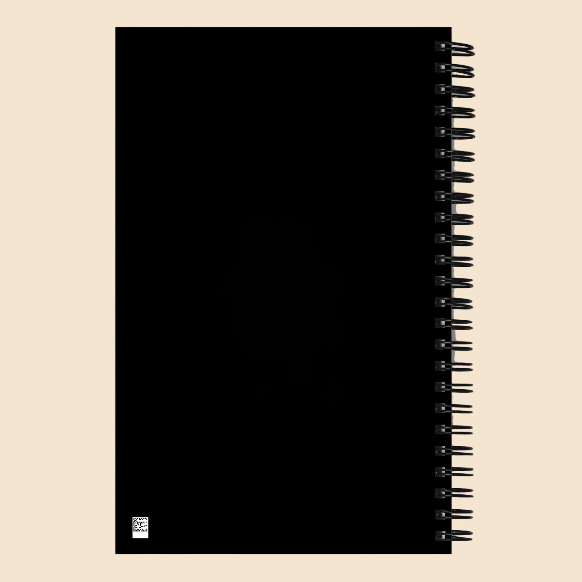 Parte trasera negra de libreta de espiral con encuadernación metálica.