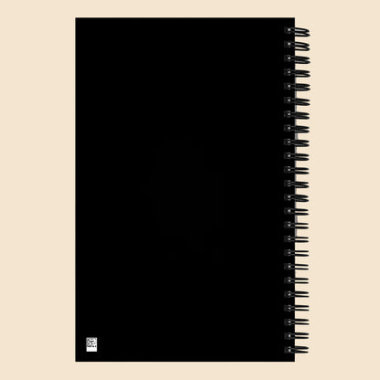 Parte trasera negra de libreta de espiral con encuadernación metálica.