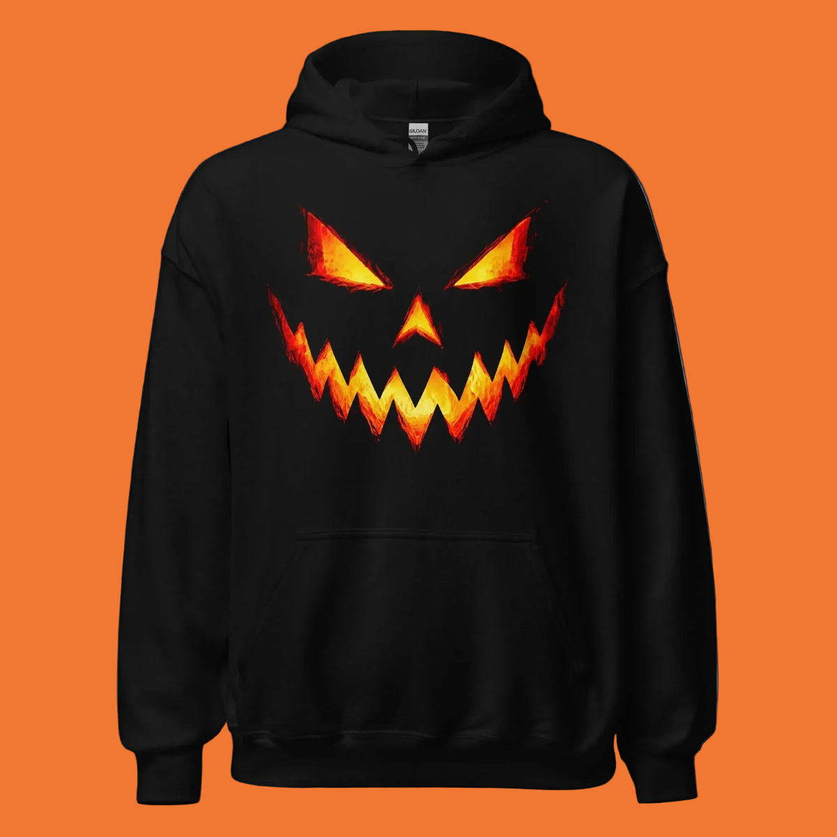 Sudadera negra con capucha y diseño frontal de calabaza de Halloween iluminada en naranja y amarillo