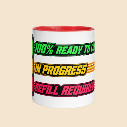 Taza de cerámica con interior rojo y diseño retro gaming 100% Ready To Conquer con indicador de batería en colores neón.
